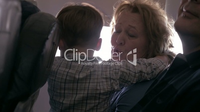 Grandchild with his grandparents in the plane