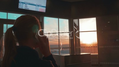 Woman having a phone talk at the airport