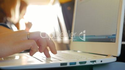 Female Fingers Typing on the Keyboard