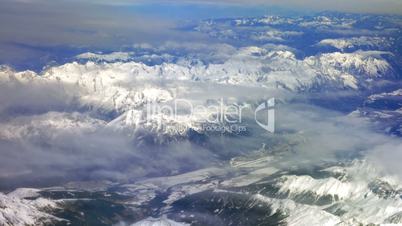 Flying over the snowy mountains