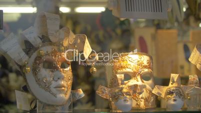 Handmade masks for Venetian carnival in glass shop-window