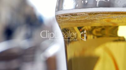 Glass with light beer in outdoor cafe