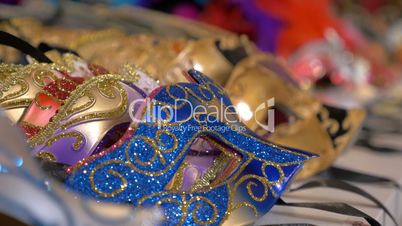 Colorful Venetian masks on the shop counter