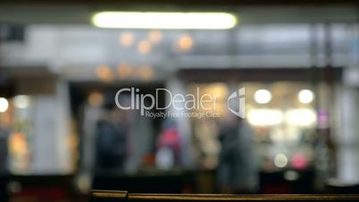 Defocused view of city street through the cafe window