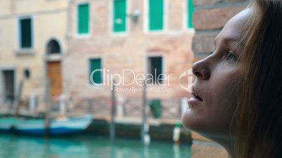 Woman with sad look outdoor in Venice