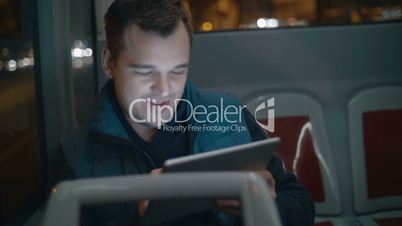 Passenger in the bus working with touch pad