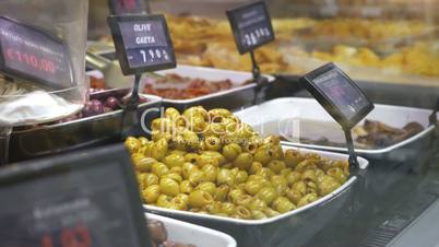 Taking picture of olives in the shop