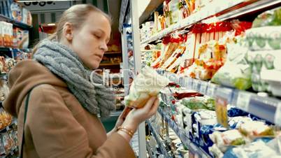 Woman in grocery choosing food