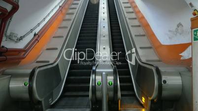 Empty underground escalator moving up