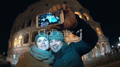 Couple making selfie in Rome at night