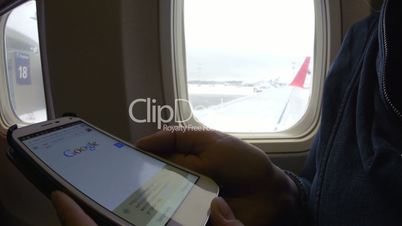 Internet surfing on cell phone before flight