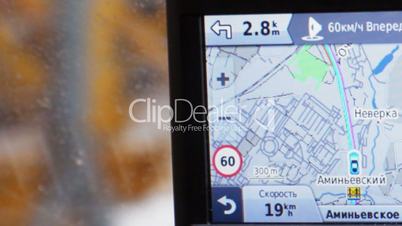 GPS in car showing way, speed and distance