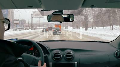 Senior traveler driving in winter city