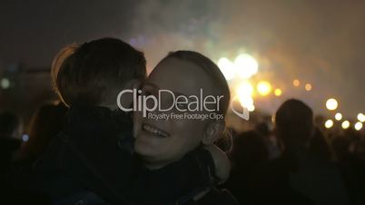 Son and mother on firework show