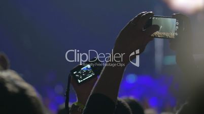 Taking shot of favorite singer with mobile