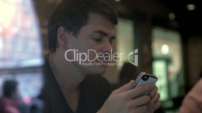 Man Writing Messages in Smartphone