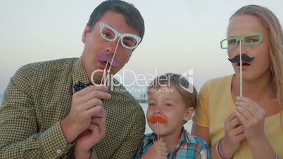 Family of three with hipster glasses and moustache