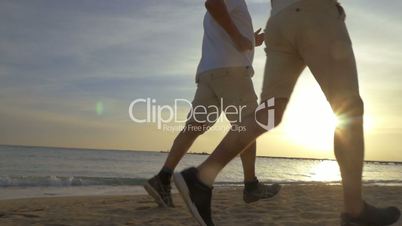 Two Men Jogging on the Beach