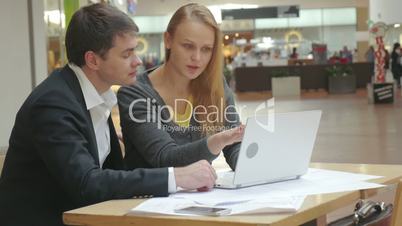 Man and Woman Discussing New Business