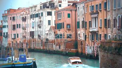 Motor Boat Sailing along the Water Canal in Venice, Italy.