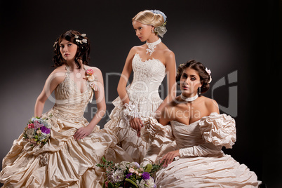 Three Young Women In Wedding Dresses