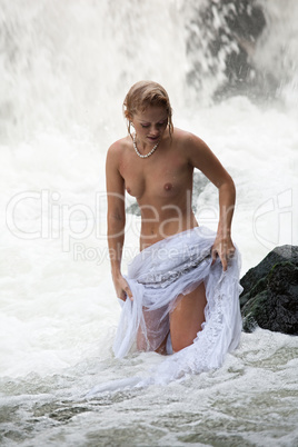 Young Topless Woman In A River