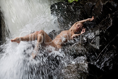 Young Nude Woman Swimming