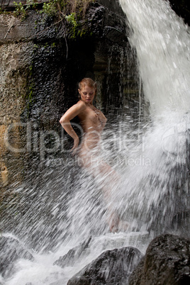 Young Nude Woman Swimming