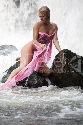 Young Nude Woman Swimming