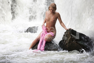 Young Nude Woman Swimming