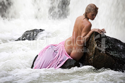 Young Nude Woman Swimming