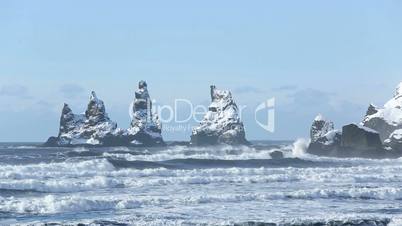 Three pinnacles of Vik, South Iceland in winter, slow motion