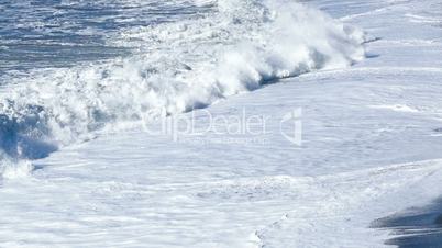 Slow motion of waves at the black sand beach coast in Vik, Iceland