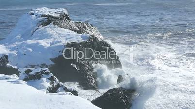 Rough waves splash at volcanic rocks in the Atlantic Ocean