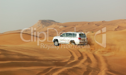 DUBAI, UAE - JUNE 12: The Dubai desert trip in off-road car is m