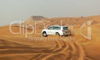 DUBAI, UAE - JUNE 12: The Dubai desert trip in off-road car is m