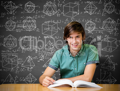 Composite image of student sitting in library reading