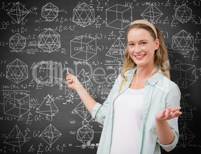 Composite image of teacher explaining maths in blackboard