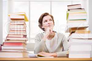Composite image of thoughtful teacher at library
