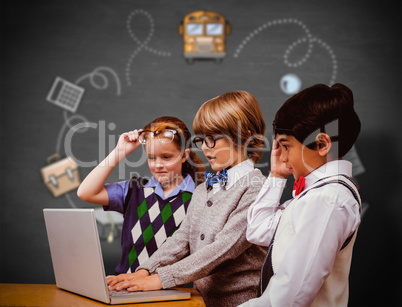 Composite image of pupils using laptop