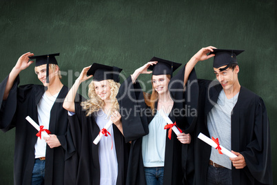 Composite image of group of teenagers celebrating after graduati