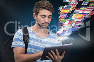 Composite image of male college student using digital tablet