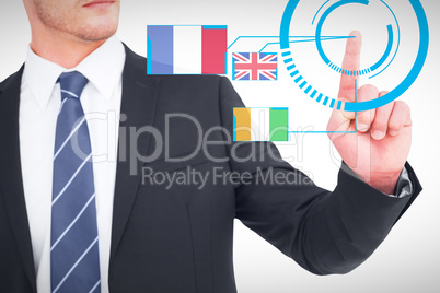 Composite image of unsmiling businessman pointing his finger