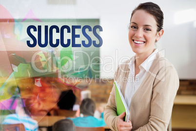Success against pretty teacher smiling at camera at back of clas