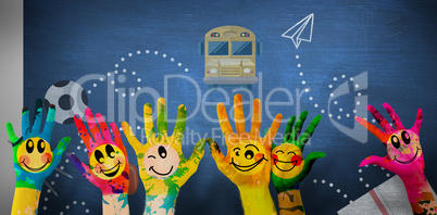 Composite image of hands with colourful smiley faces