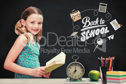 Composite image of girl reading book in library