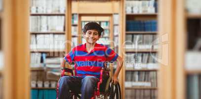 Composite image of boy sitting in wheelchair in school corridor