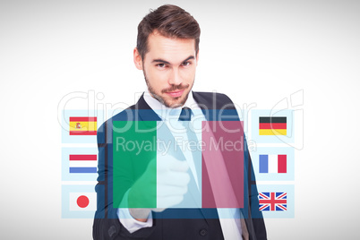 Composite image of smart businessman in suit pointing at camera