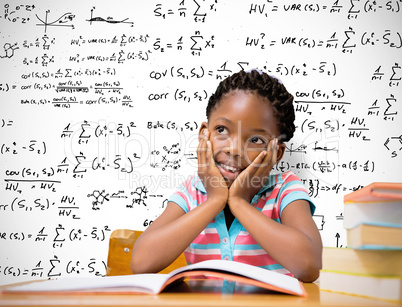 Composite image of pupil sitting at her desk