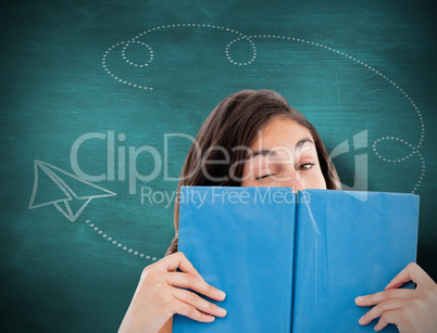 Composite image of portrait of a student winking behind a blue b